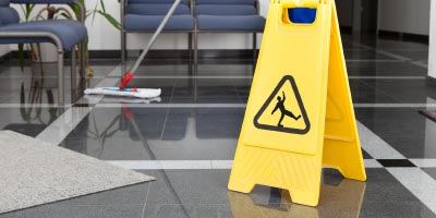 Sign cautioning people not to slip on a clean floor