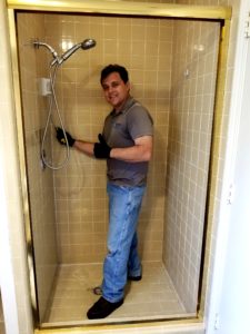 Frank Listorti cleans a shower at a home in Richardson. Texas